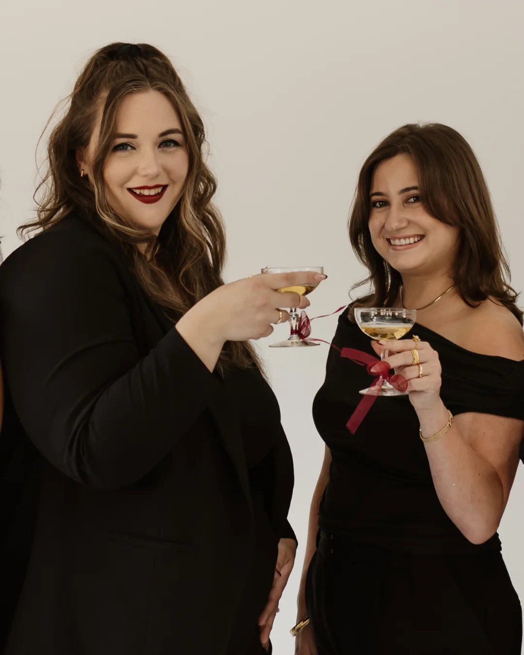 Tara and Keeley, founders of The Social Planner, celebrating with a champagne toast